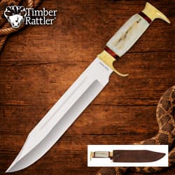 Large knife with bone handle on wooden background