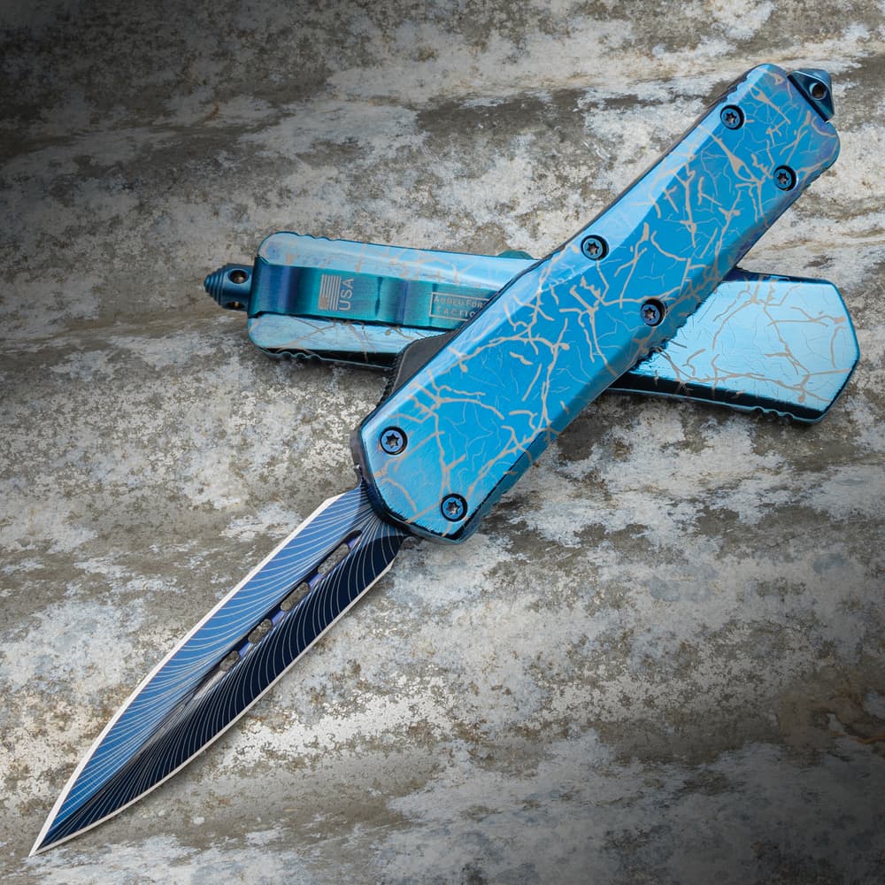 The Lightning Blue Auto Pocket Knife, both open and closed, displayed against a marbled backdrop, showcasing its sleek aluminum handle. image number 0