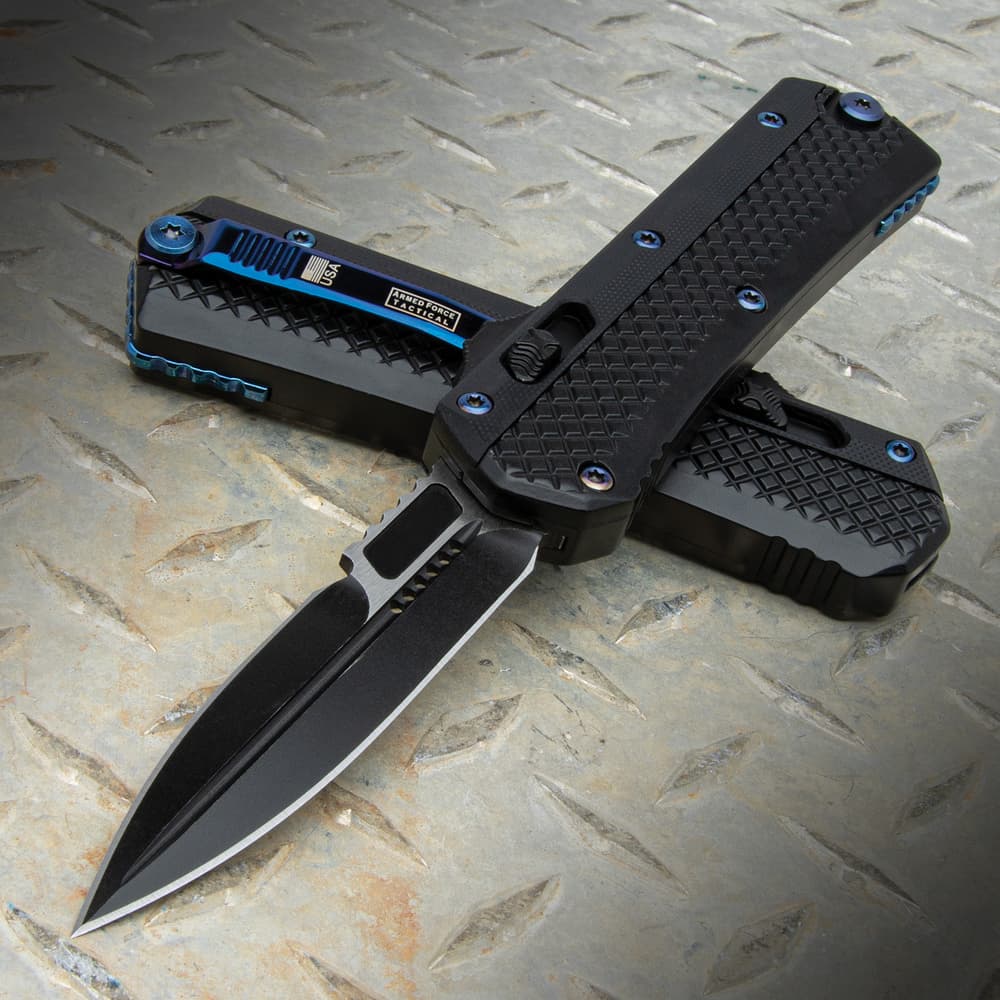 The Black and Blue Dagger OTF Knife with black G10 handle and black stainless steel blade, shown both opened and closed. image number 0