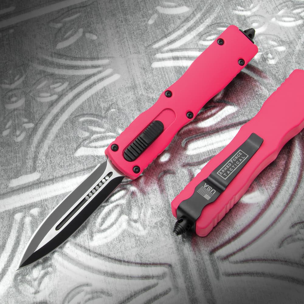 The Pink Dagger Automatic OTF Knife with hot pink handle and black dagger-style blade, shown both opened and closed. image number 0