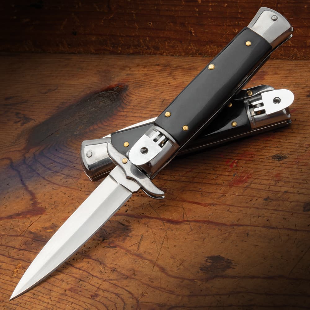 Full image of the Black Lever Lock Automatic Knife open and closed. image number 0