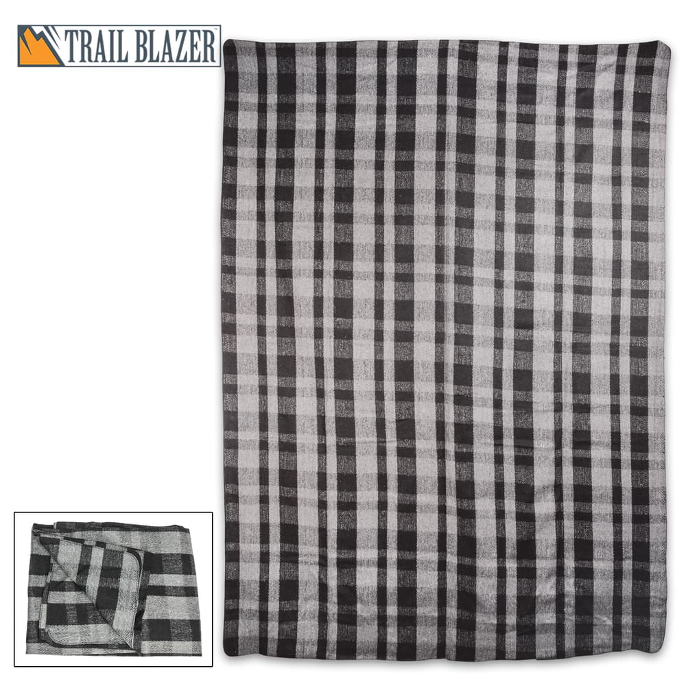 Bundle up and stay warm even in the coldest temperatures when you snuggle up in this oversized plaid wool blanket image number 0