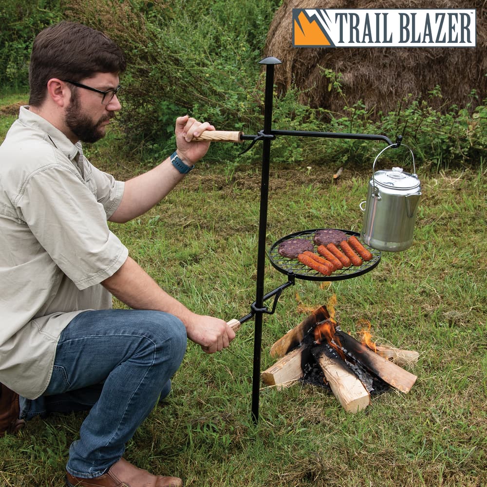 The Trailblazer Fire Pit Grill And Cooking Pot Hanger allows you to cook and boil at the same time image number 0