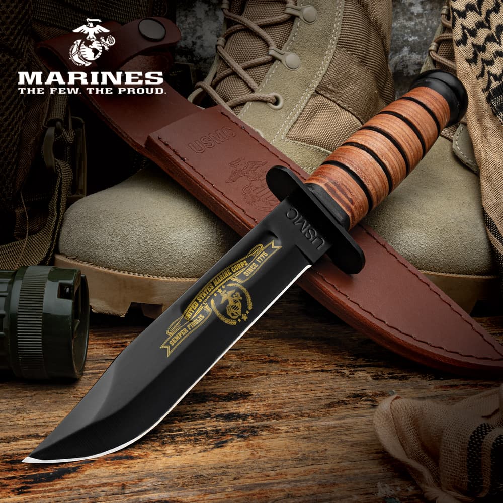 Full image of the USMC Tribute Combat Knife propped up. image number 0