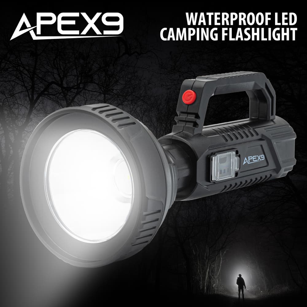 This image shows the Apex9 Waterproof LED Camping Flashlight on top of a photo of a man shining a light into a dark forest. image number 0