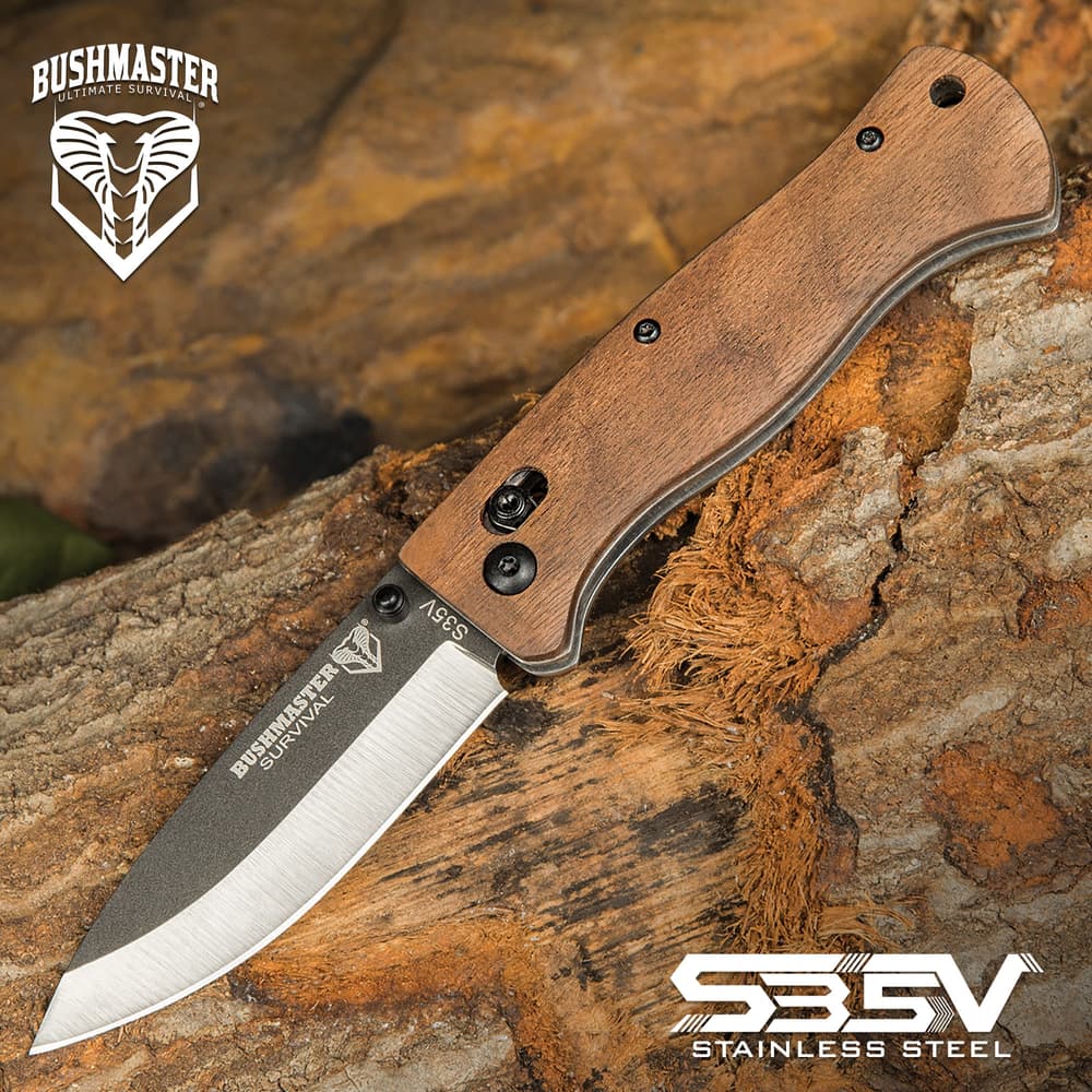 Hardness and durability are the hallmarks of the richly veined zebra wood used to craft the handle scales of the Bushmaster Bushcraft Explorer Pocket Knife image number 0