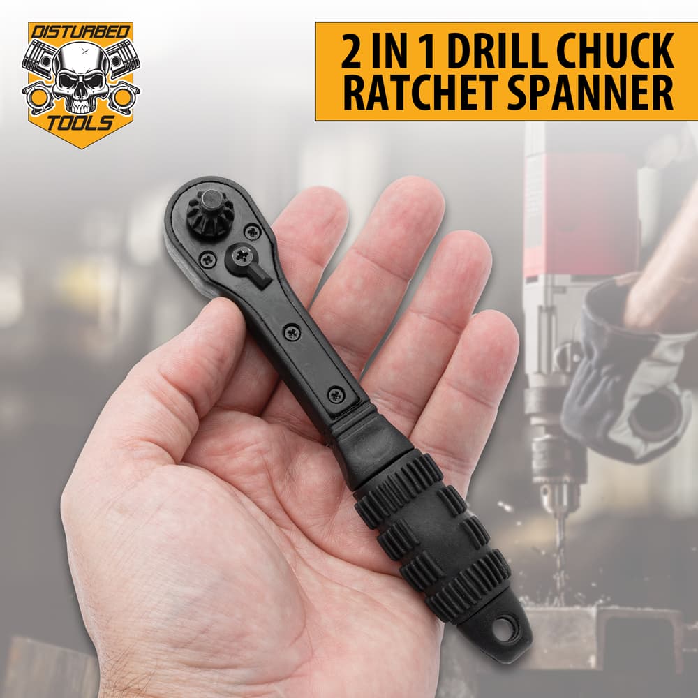Full image of Disturbed Tools 2 In 1 Drill Chuck Ratchet Spanner held in hand. image number 0
