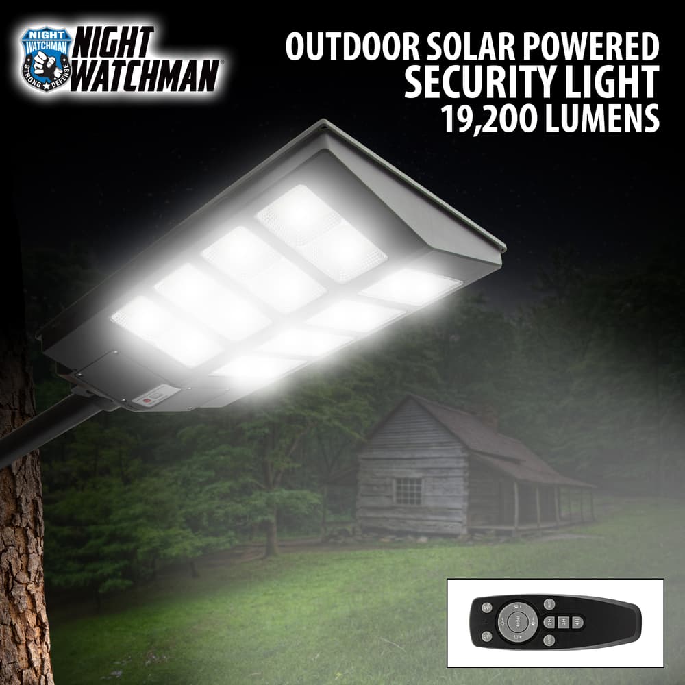 Full image of the Night Watchman Outdoor Solar Powered Security Light 19,200 Lumens with the light on. image number 0