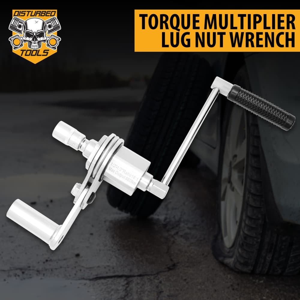 Torque multiplier lug nut wrench with a car with flat tire in background. image number 0