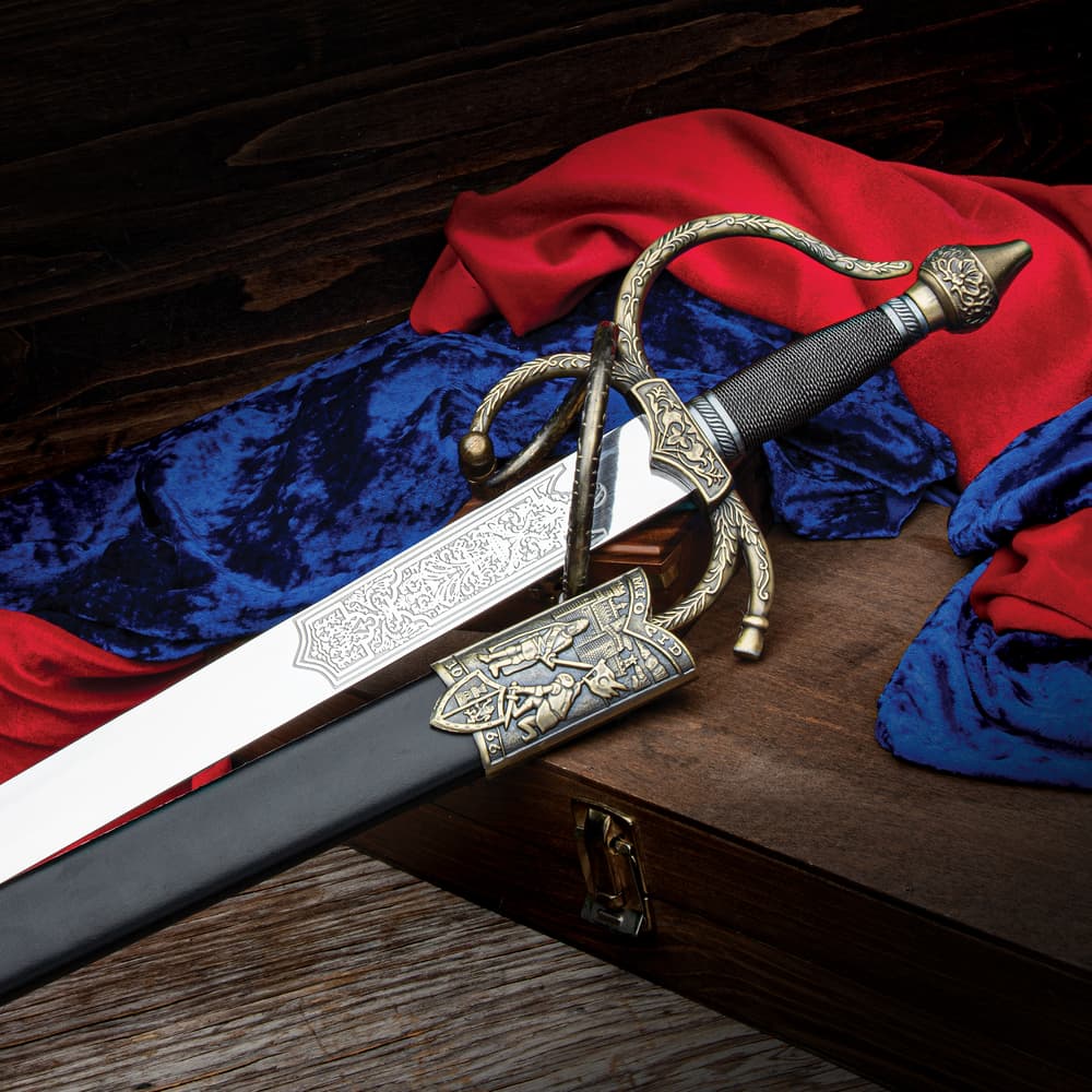 This Mio Cid Knight's templar rapier sword has details of the knight Mio Cid cast into the scabbard. The handle is wire wrapped with a unique hand guard. image number 0
