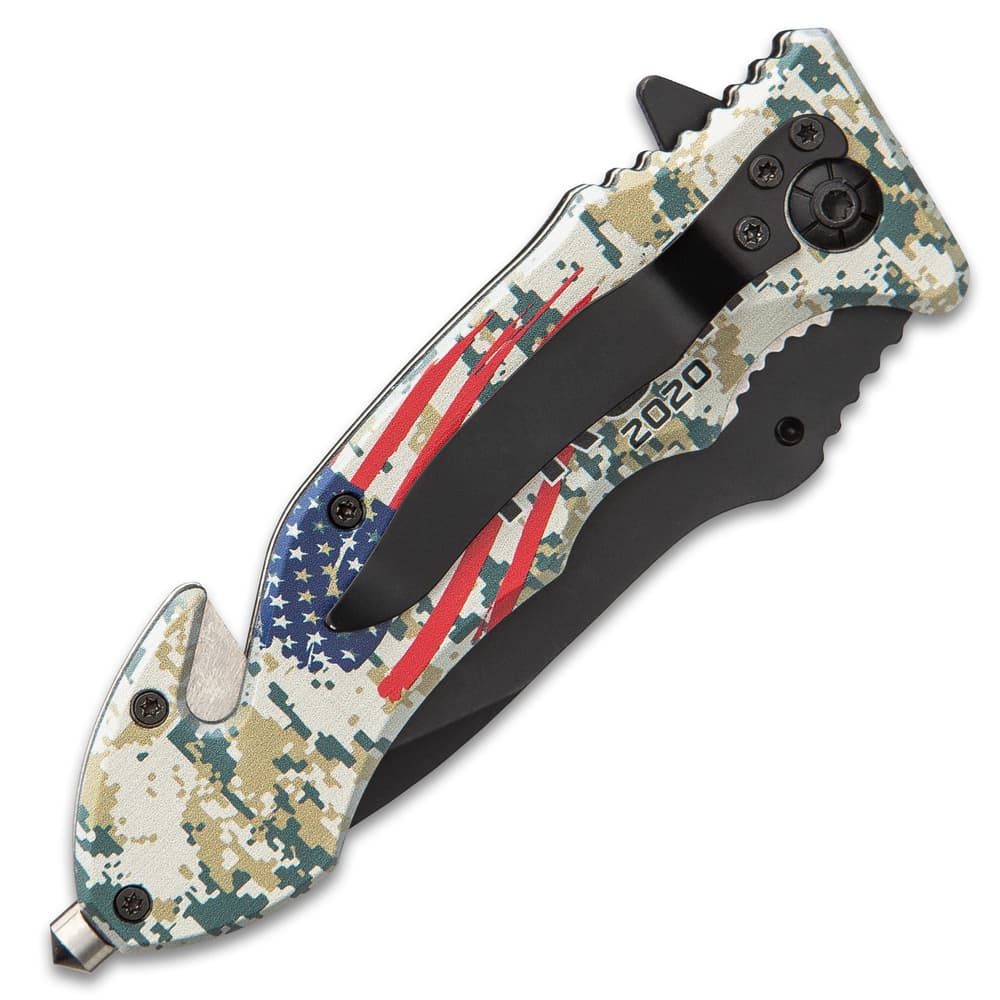 The assisted opening pocket knife has a 3 3/4” black stainless steel blade and a camouflage aluminum handle with an American flag image number 1