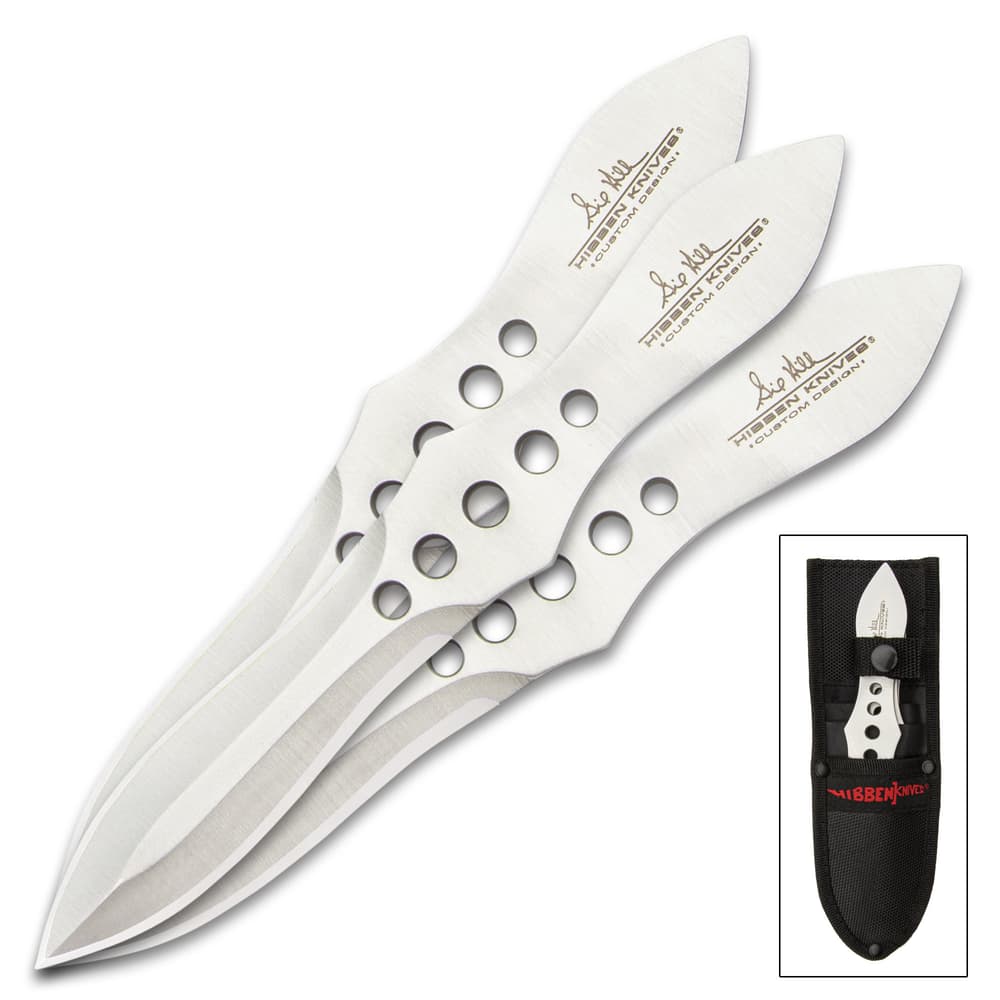 Three 3 3/4" stainless steel "Gil Hibben" double-edged throwing knives. Bottom right corner knives enclosed in sheath. image number 1