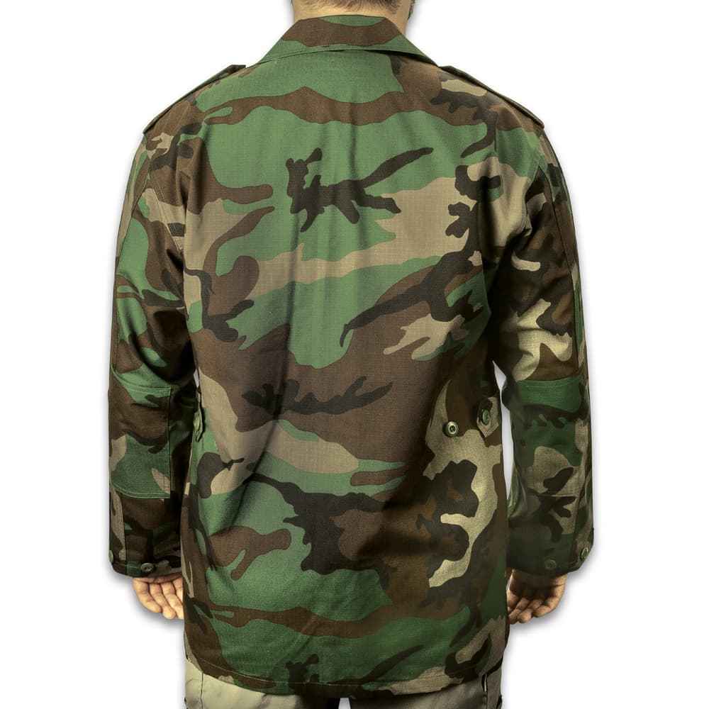 The woodland camo shirt has a tough, 65-percent polyester and 35-percent cotton rip-stop construction that’s comfortable for all-day wear image number 1
