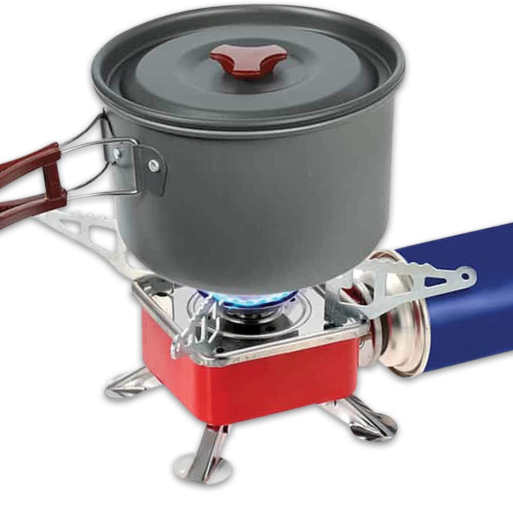Four fold-out serrated pot supports provide a stable cooking surface for a wide variety of cookware image number 1