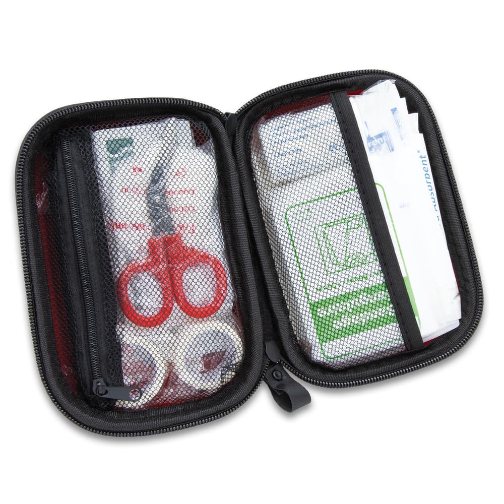 It includes assorted sizes of bandages and dressings, adhesive tape, alcohol prep pads, sting relief pads, antiseptic towelettes image number 1