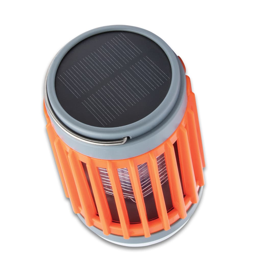 The lantern has a water-resistant, orange ABS construction with a metal hanger on top image number 1