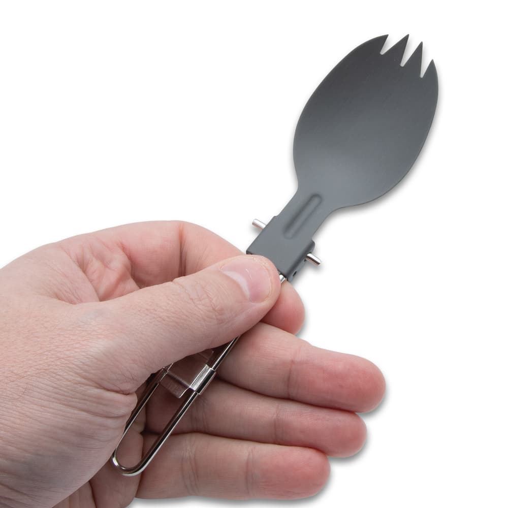 The spork shown in hand image number 1