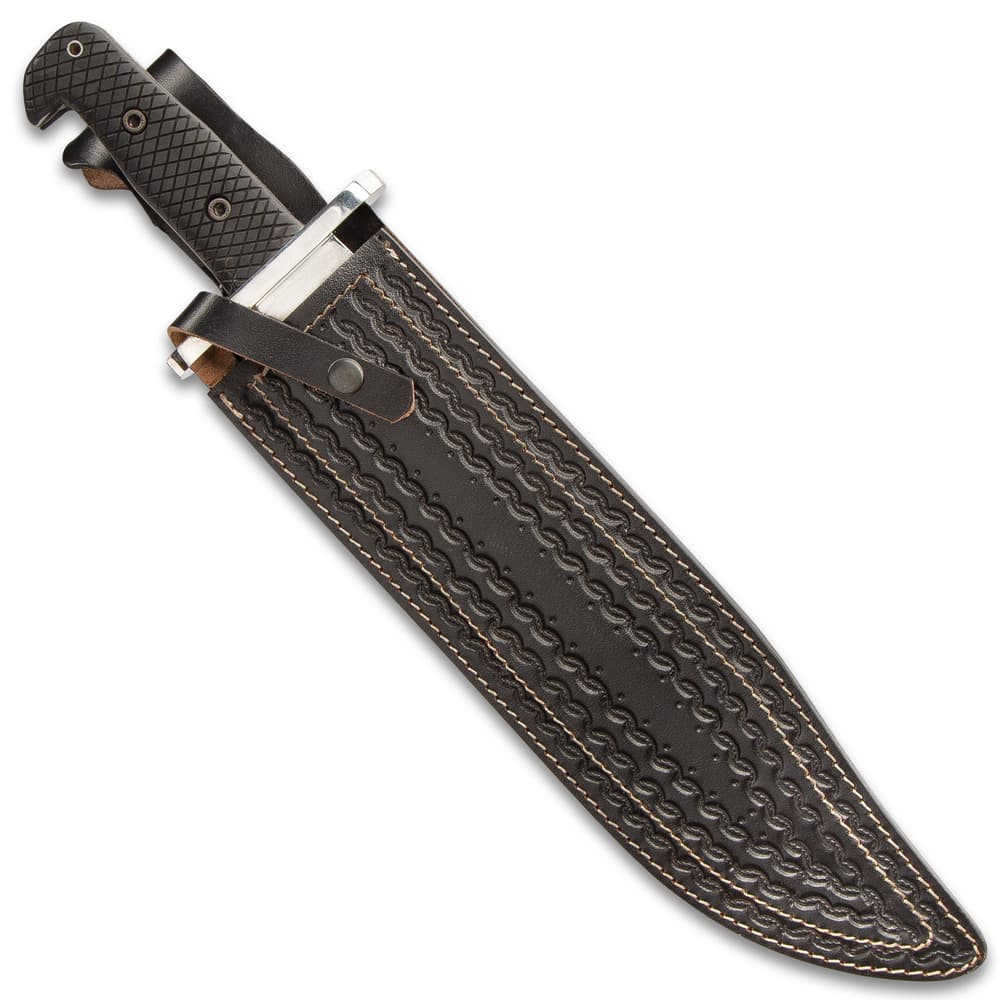 Large knife in a dark brown leather sheath with various intricate stamped details and a snap button closure. image number 1