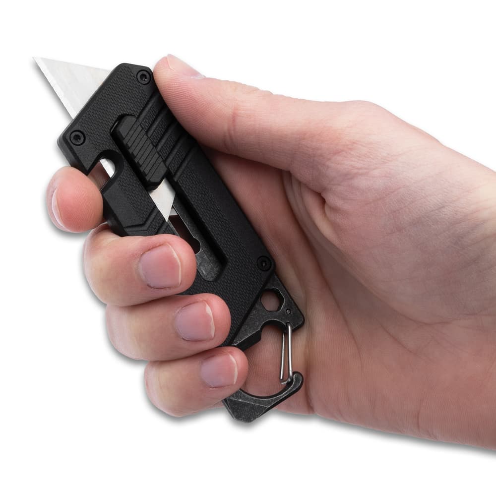 The utility blade can be deployed with a slide trigger\ image number 1