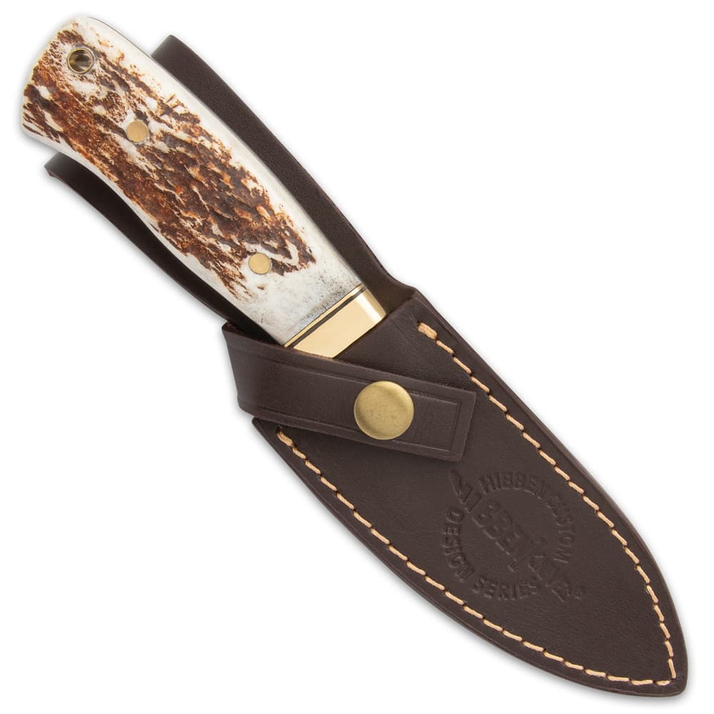 The 8 3/4” overall fixed blade slides securely into a leather belt sheath with a snap closure handle strap and top-stitching image number 1