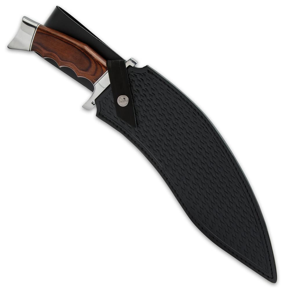 The 17 3/8” overall kukri knife slides smoothly into a genuine leather, basket-woven belt sheath with a snap strap closure image number 1