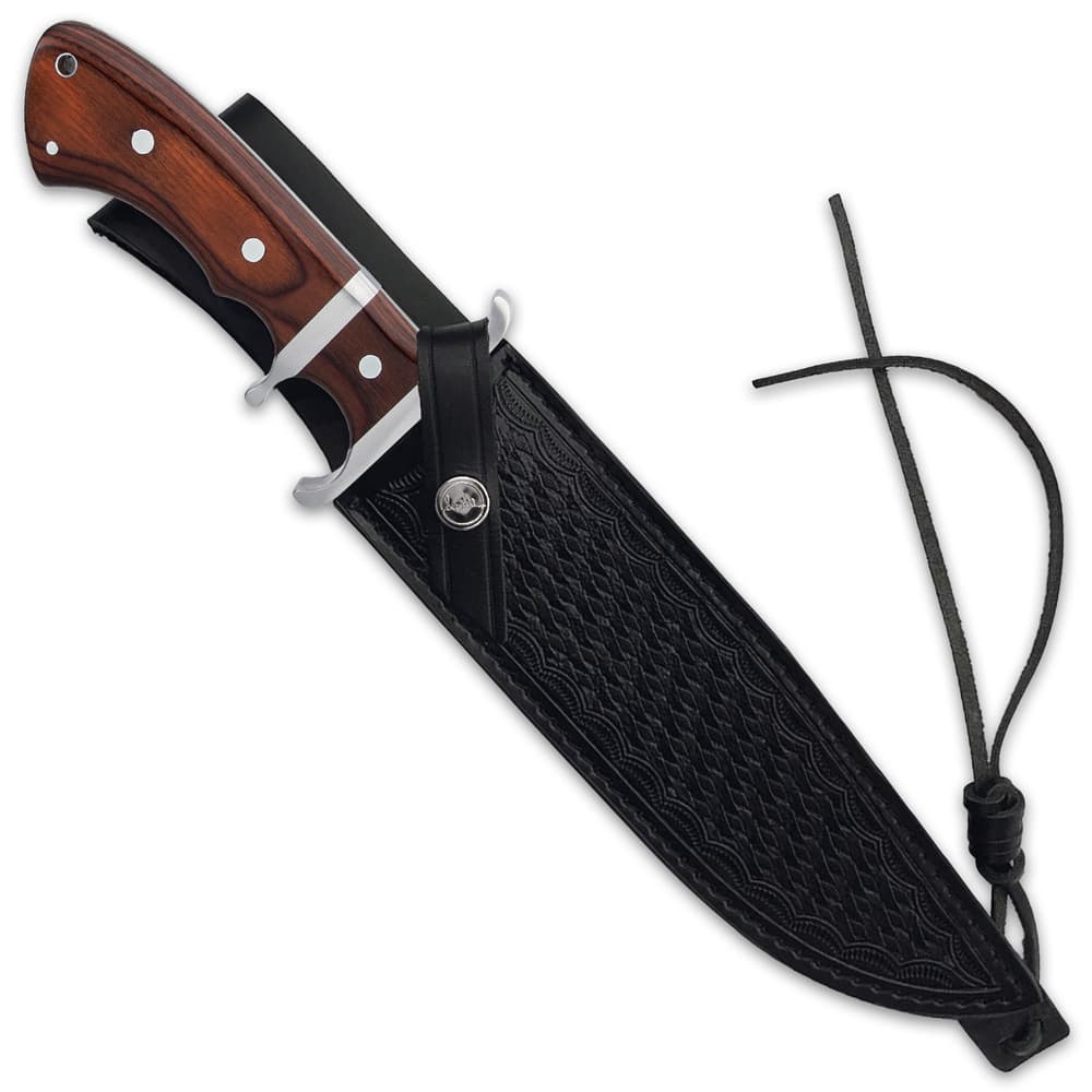The 14 1/8” overall knife can be securely carried in its premium leather belt sheath and a lanyard hole offers another carry option image number 1