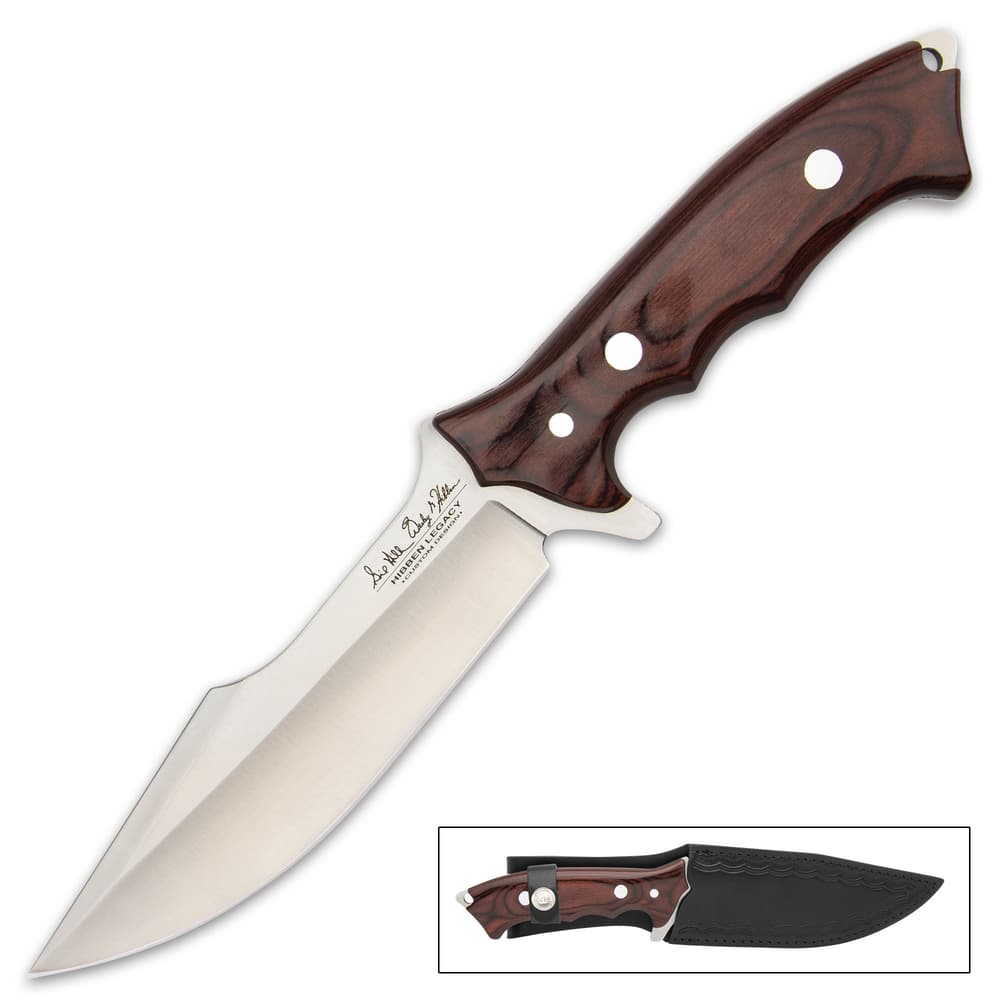 The 12 1/8” overall knife can be stored and carried at your side in a leather belt sheath, embossed with the Hibben logo image number 1