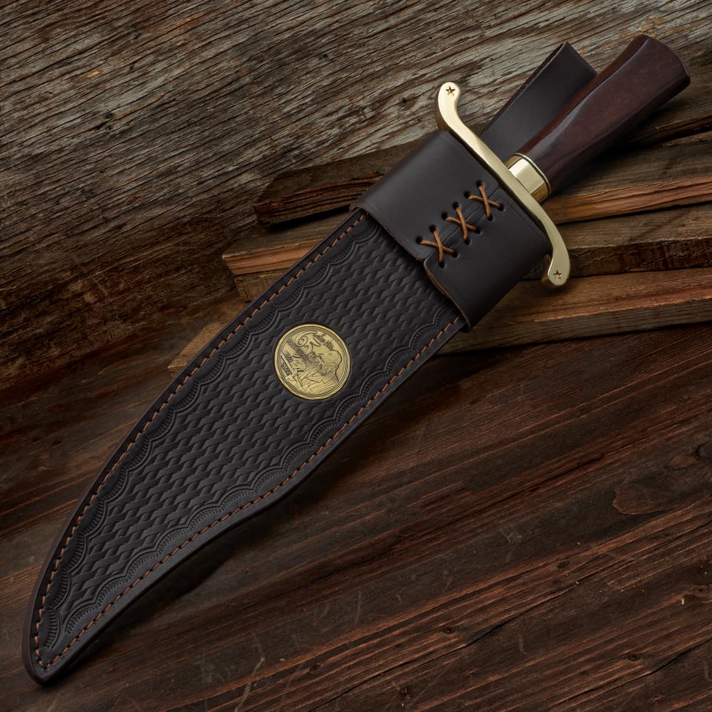 The Gil Hibben Bowie in its leather sheath image number 1