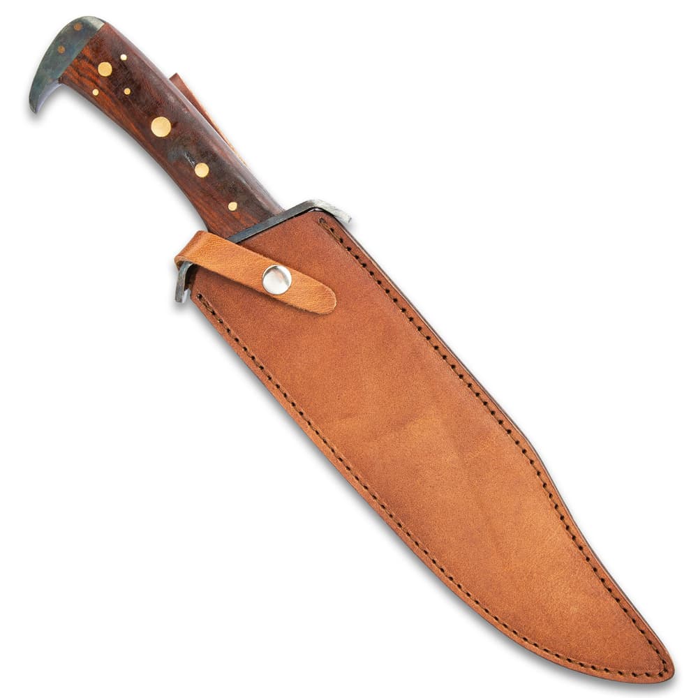 The 16 1/2" overall bowie knife can be store in its handmade leather belt sheath with snap strap closure. image number 1