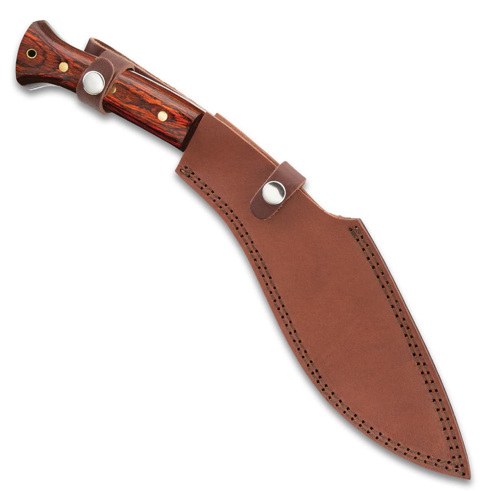 The kukri is shown secured into its premium leather belt sheath with a snap closure. image number 1