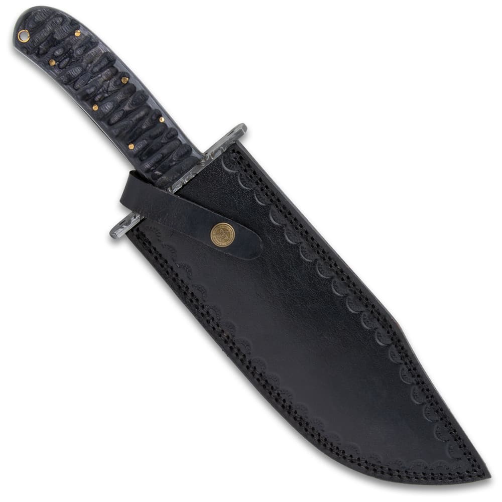 The fixed blade knife in its sheath image number 1