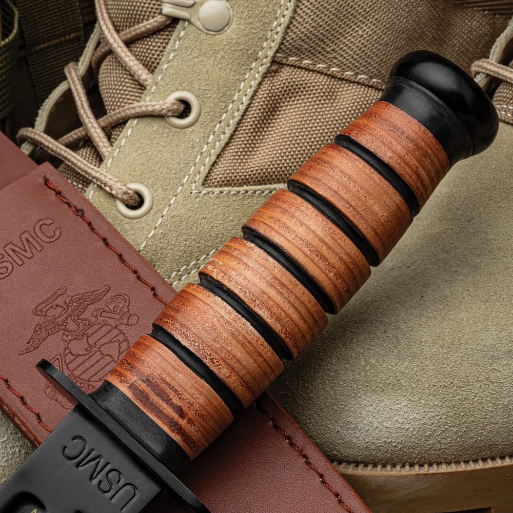 Close up image of the USMC Tribute Combat Knife stacked leather handle. image number 1