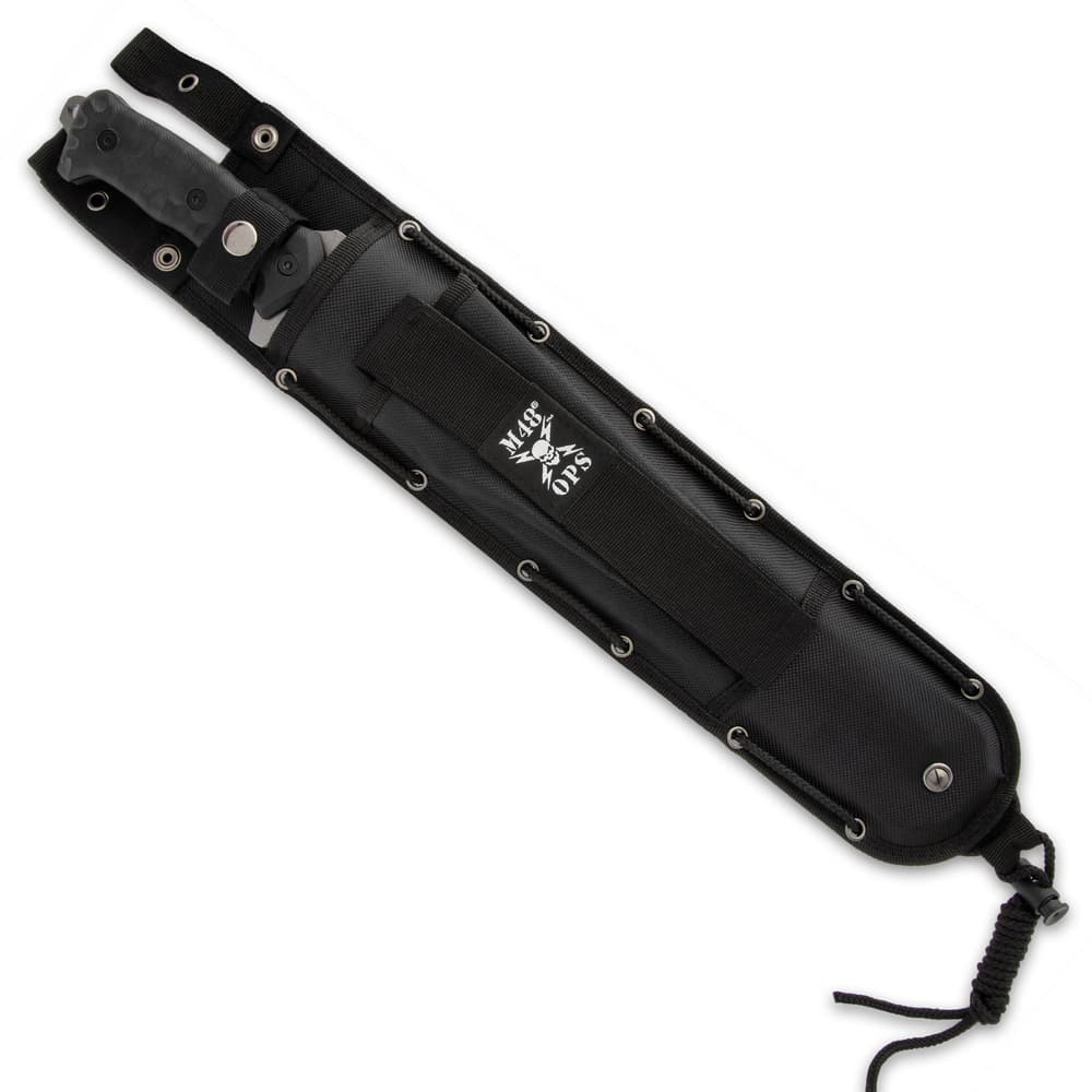 Combat machete enclosed in a black nylon sheath with a "M48 Ops" logo printed onto the elastic strap. image number 1