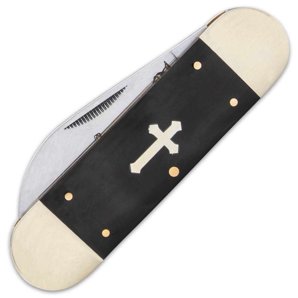 It has sleek and smooth black bone handle scales, which features an inlaid nickel-silver cross and brass pins image number 1