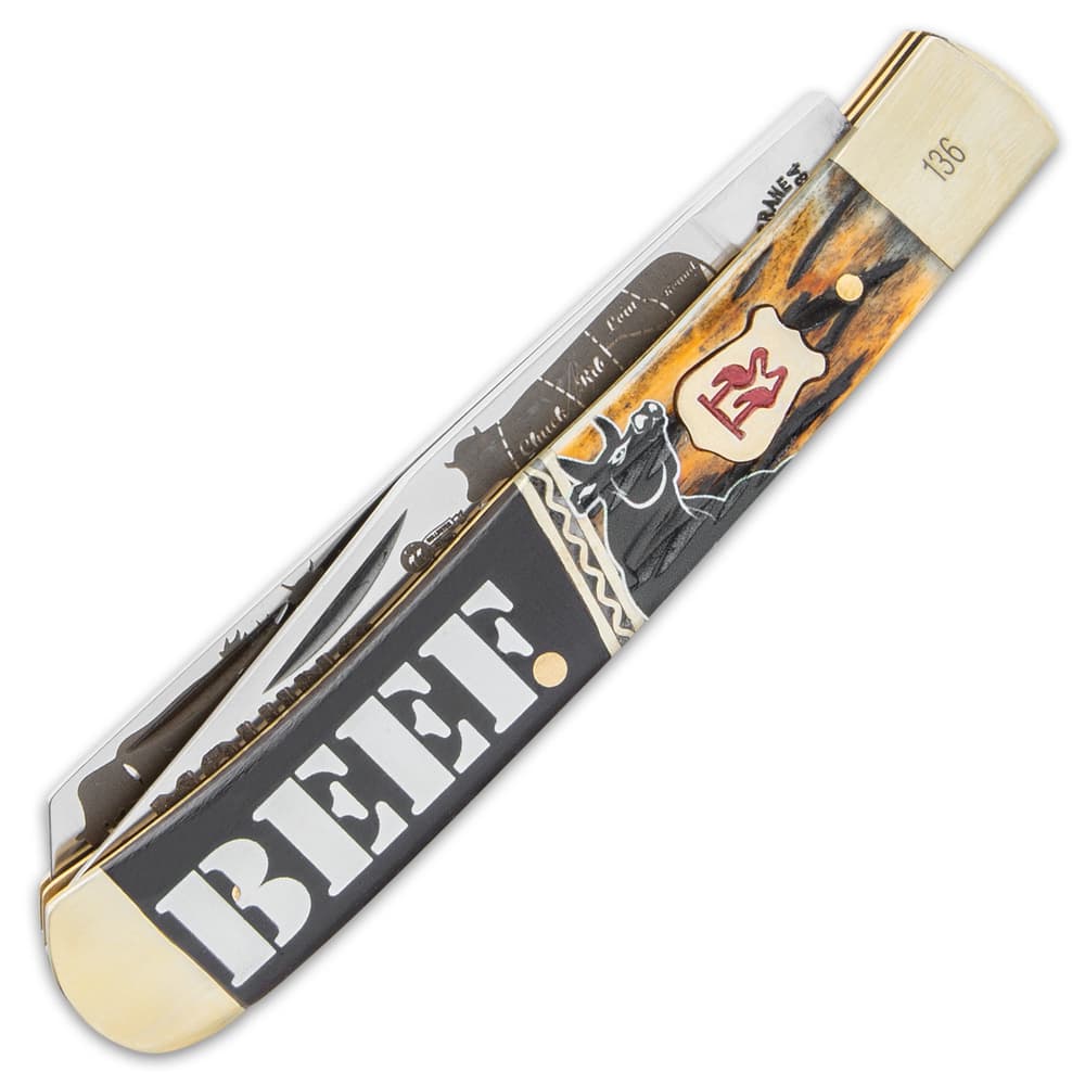The handsome handle is made of brown jigged bone with printed artwork and dark wood with “Beef” engraved into it image number 1