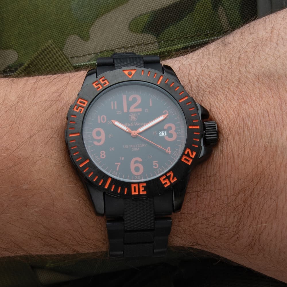 The military-style watch shown on a wrist image number 1