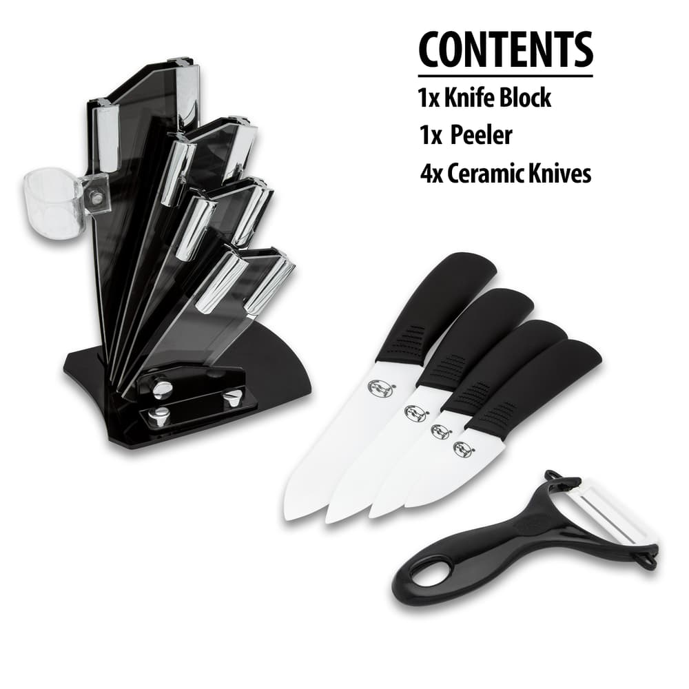 The black knife block is shown next to the knife set and included peeler. image number 1