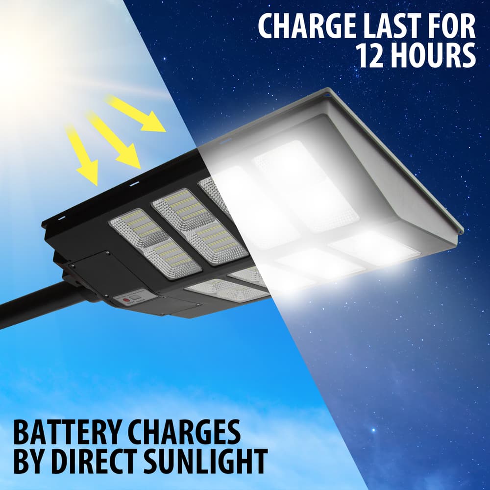 Full image showing batteries of the Outdoor Solar Powered Security Light 19,200 Lumens being charged by direct sunlight. image number 1