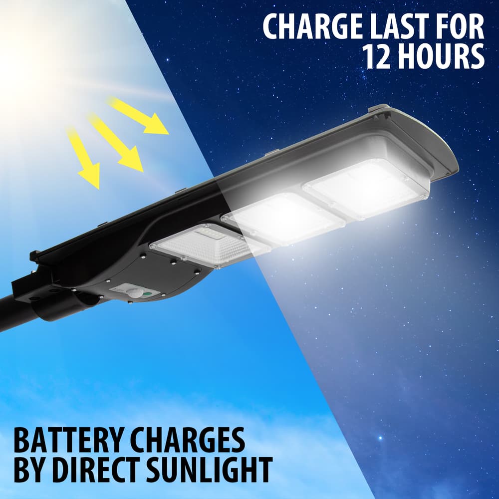 Full image showing batteries of the Outdoor Solar Powered Security Light 9,000 Lumens being charged by direct sunlight. image number 1