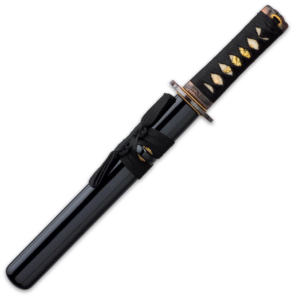 The 15 1/4” overall tanto sword fits like a glove in a black, lacquered wooden scabbard with black cord accents image number 1