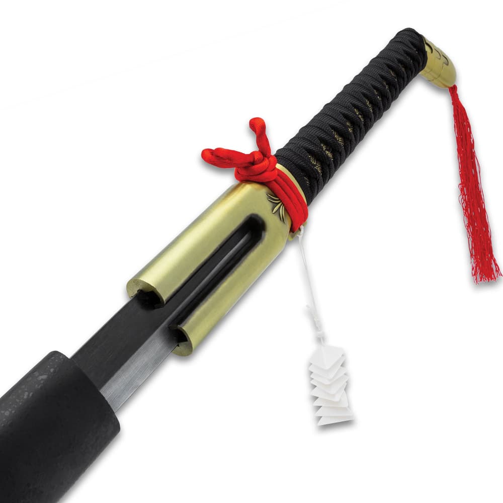 The wooden handle is wrapped in white, faux rayskin and black cord and it features a gold metal handle with a red tassel image number 1