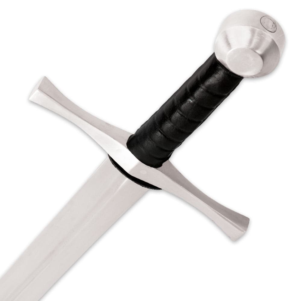 Zoomed view of the black leather grip with metal rounded pommel and guard. image number 1