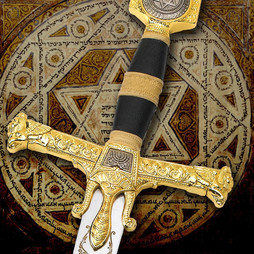 Zoomed in view of the intricate detailing of the sword, with a focus on the gold plated pommel and guard with the Star of David and Ark of the Covenant symbols. image number 1