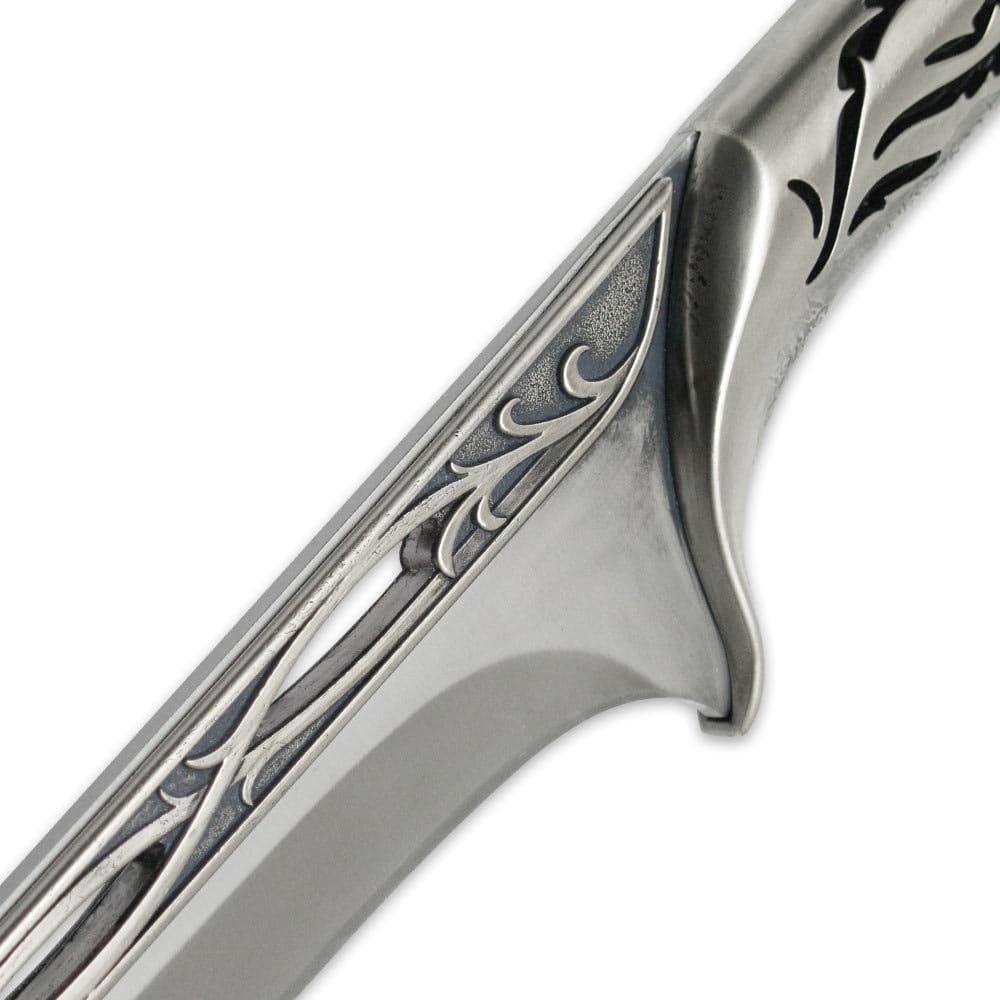 Zoomed view of the vine detailing that runs along the hilt and blade. image number 1
