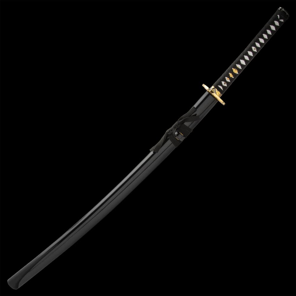 The 41 7/10” katana slides smoothly into a black lacquered, wooden scabbard with an intricate flower design image number 1
