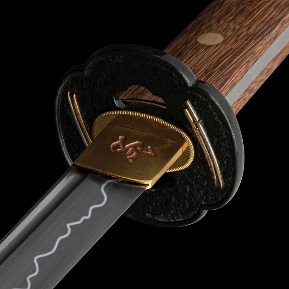 A close-up of the tsuba and blade image number 1