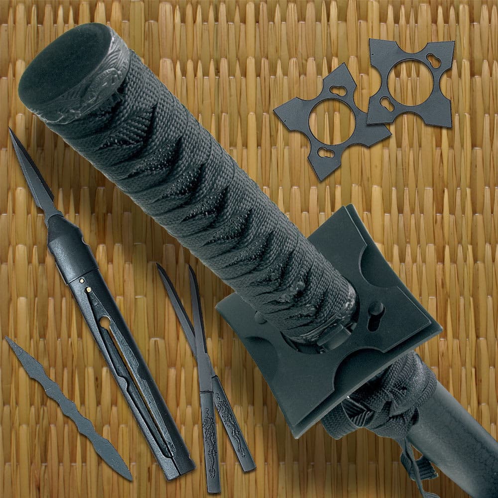 The throwing stars are shown attached to the guard of the ninjato sword next to the throwing knives and mini tanto. image number 1