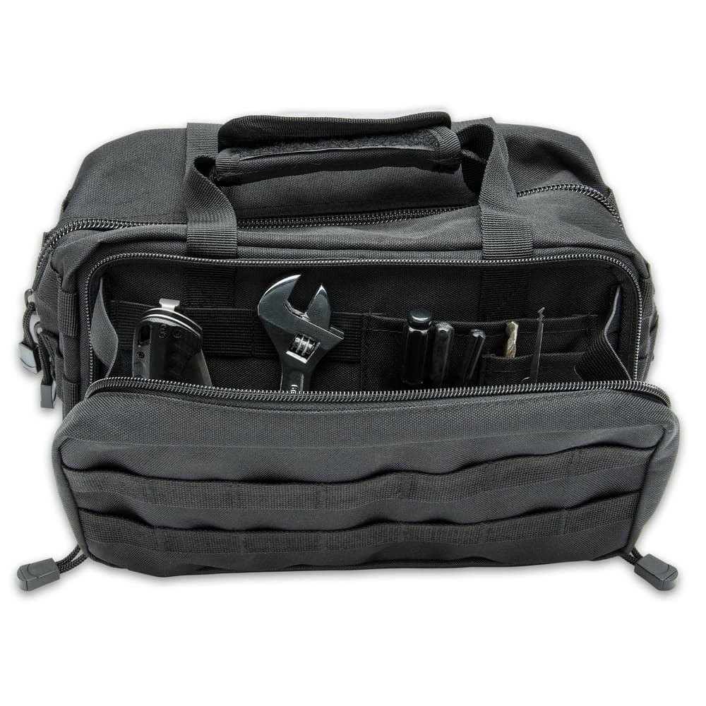 The toolkit bag has a large, main zippered compartment that contains individual slots to store tools and other gear image number 1