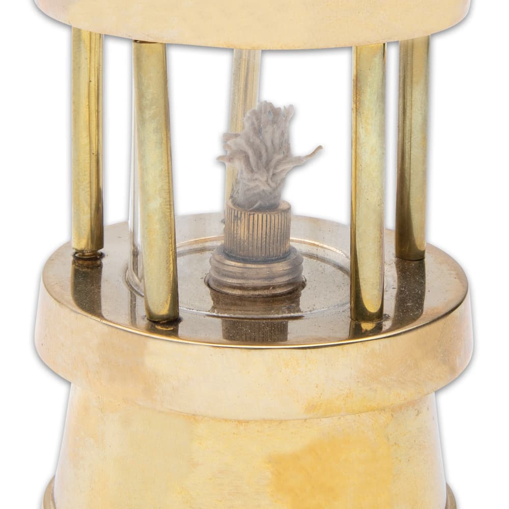 The working oil lamp (oil not included) has a solid brass and glass construction with a cotton wick, and it features a hanging hook image number 1