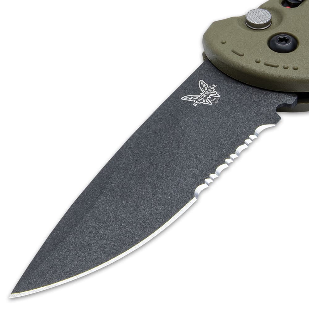 The sharp 3 3/5”, cobalt black CPM-D2 steel, drop point blade is partially serrated and has a 60-62 HRC image number 2